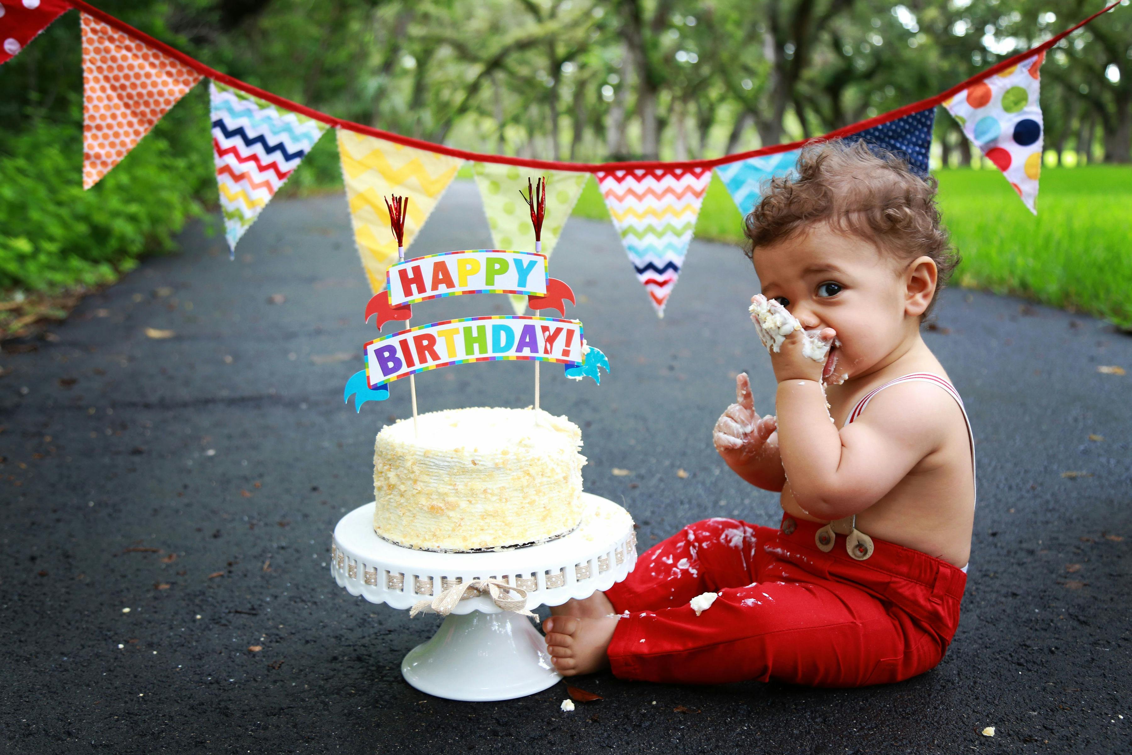 baby eating cake