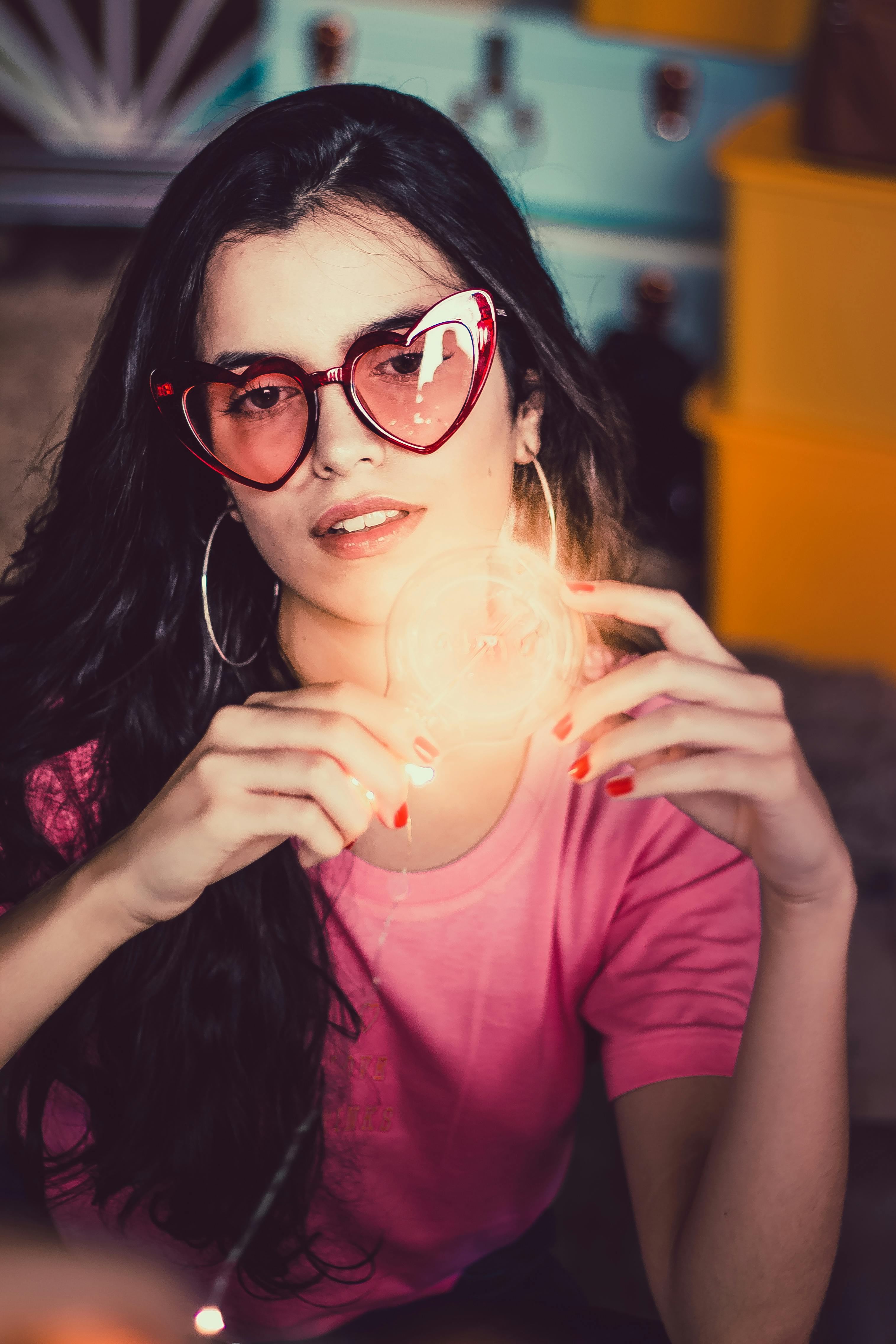 Woman Holding Bulb · Free Stock Photo