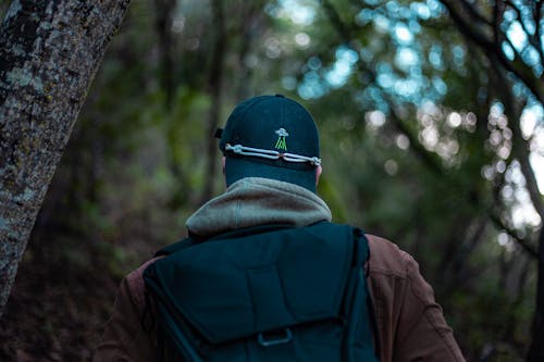 Man Standing Under Tree