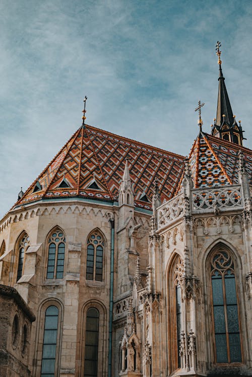 A cathedral with a spire and a clock tower