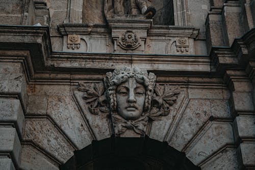 A close up of a building with a face on it