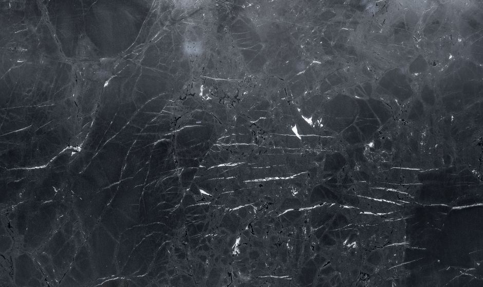 High-resolution dark marble texture, perfect for elegant backgrounds and design projects.