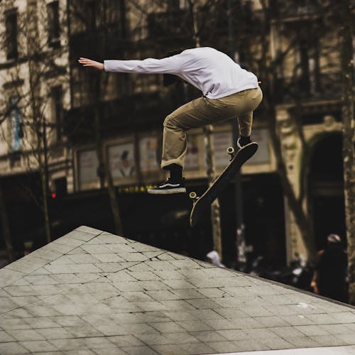 Man Playing With Skateboard