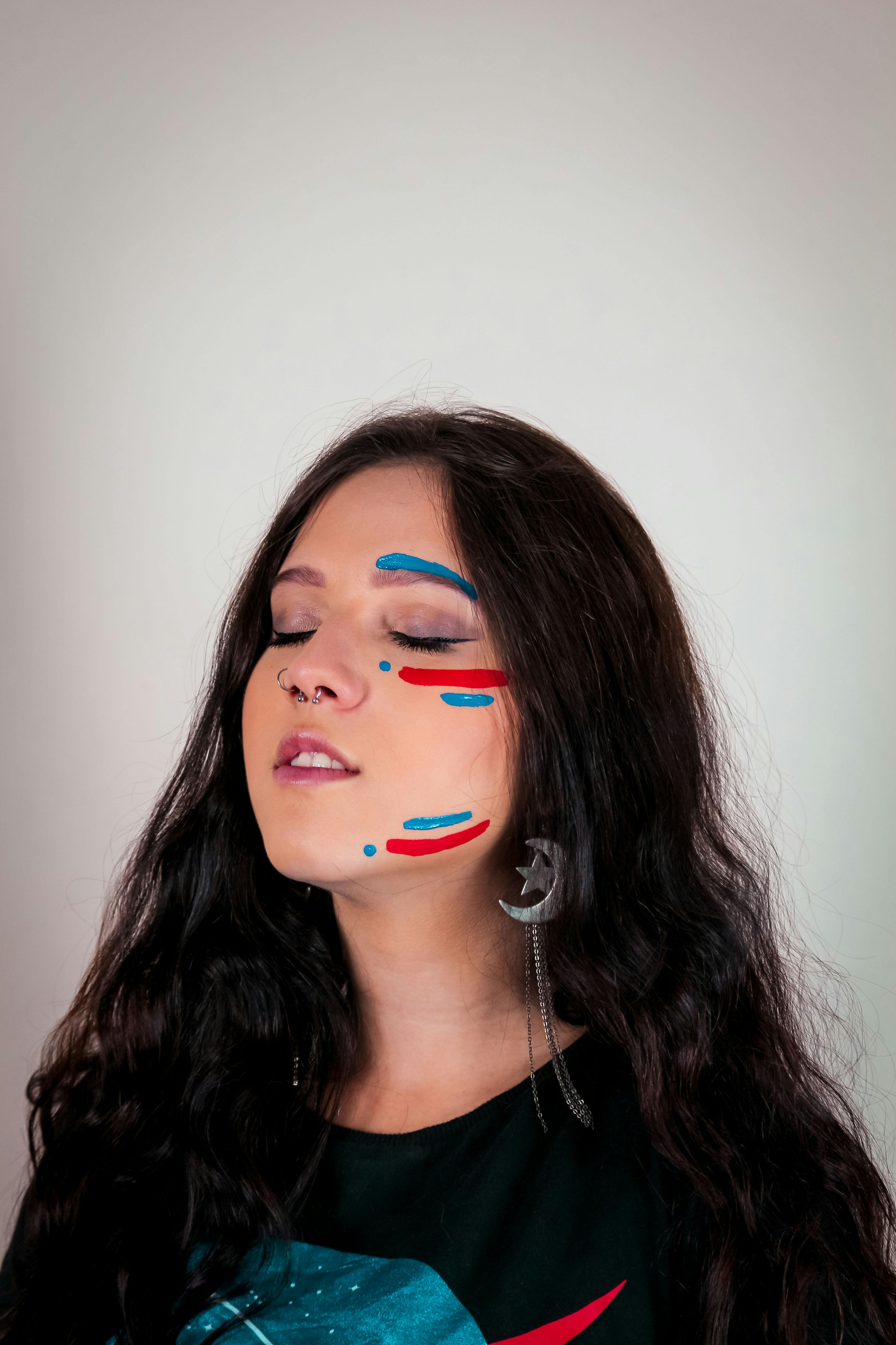 Side View Photo of Woman With Her Eyes Closed Holding Her Her As