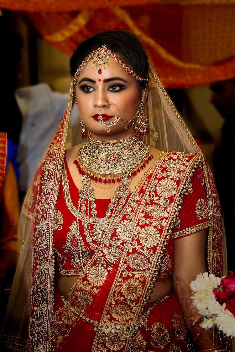 Woman Wearing Red And Gold Saree Wedding Dress
