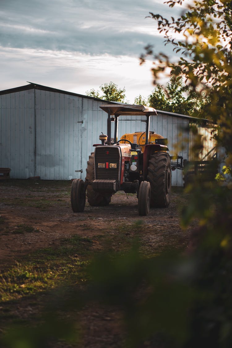 Tractor And Shed At Farm