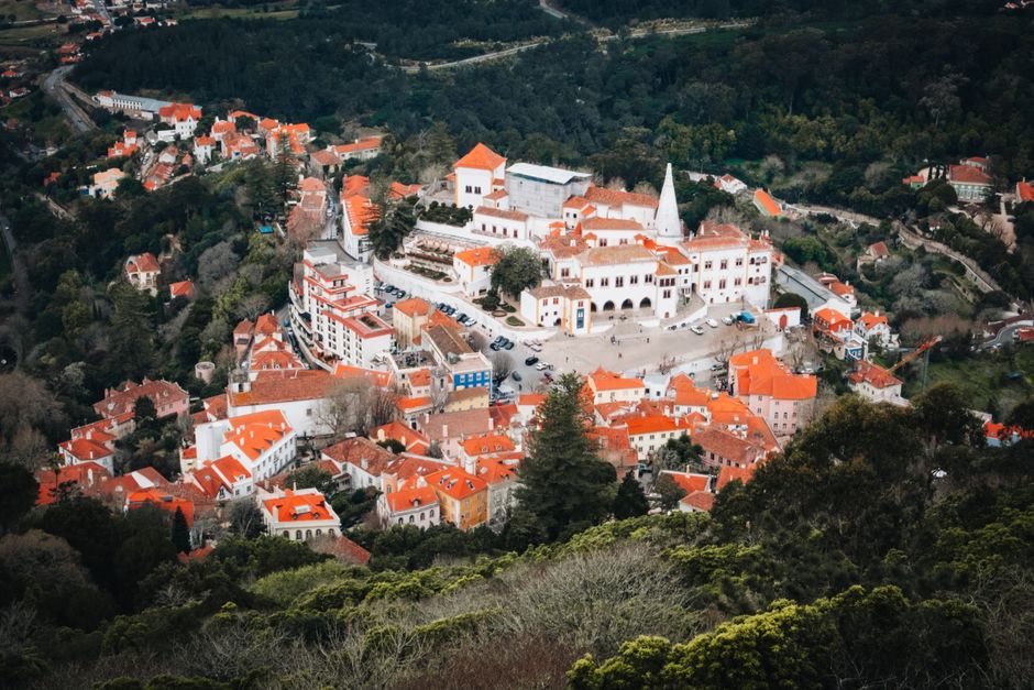 Aerial view of Sintra National Palace surrounded by the town and green hills