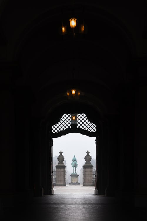 A view of a doorway with a statue in the background