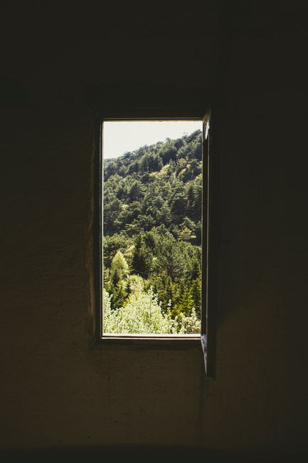 Captivating forest landscape seen through a rustic window in Göynük, Türkiye.