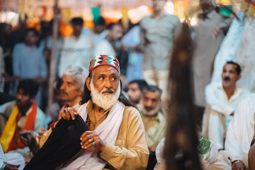 Close-up of a man in traditional attire at a cultural gathering in Lahore, Pakistan.