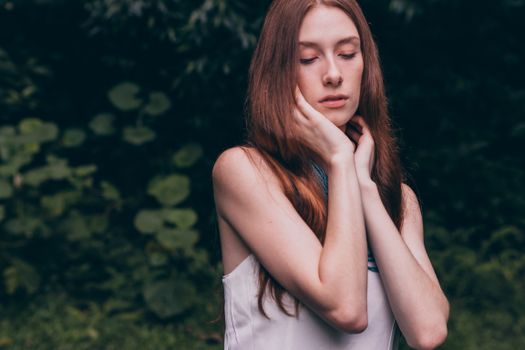 Woman Closing Her Eyes Wearing White Tank Top