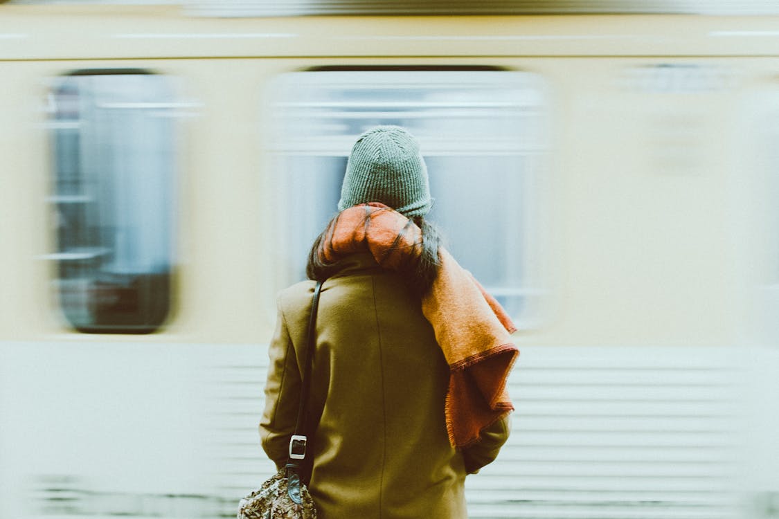 Time-Lapse Photography of Person Standing Near Train · Free Stock Photo