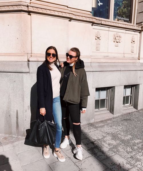 Free Two stylish women enjoying a sunny day in Östermalm, Stockholm, Sweden. Stock Photo