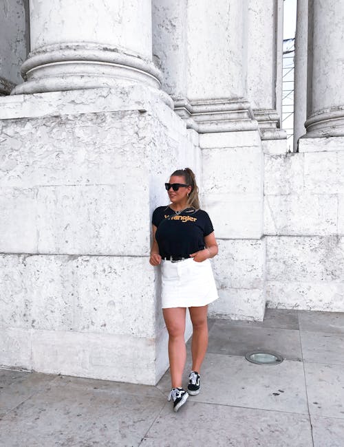 Woman Leaning on Concrete Wall