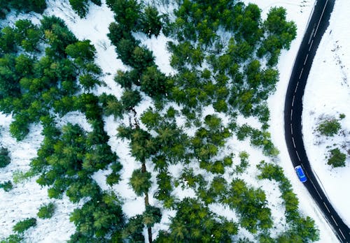 An aerial view of a road in the snow