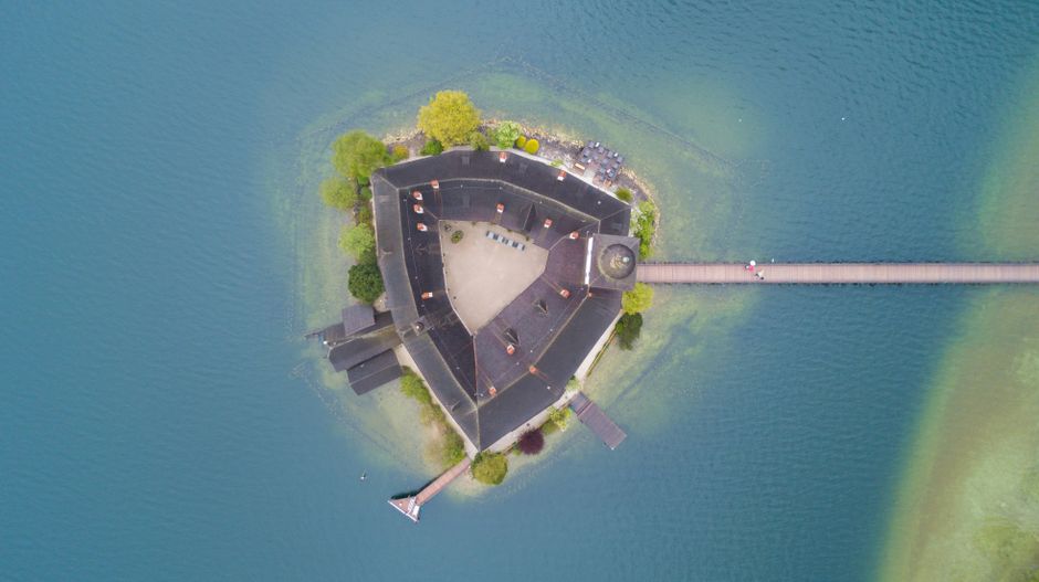 Stunning Trakai Island Castle surrounded by water in Lithuania, a must-visit historical attraction.