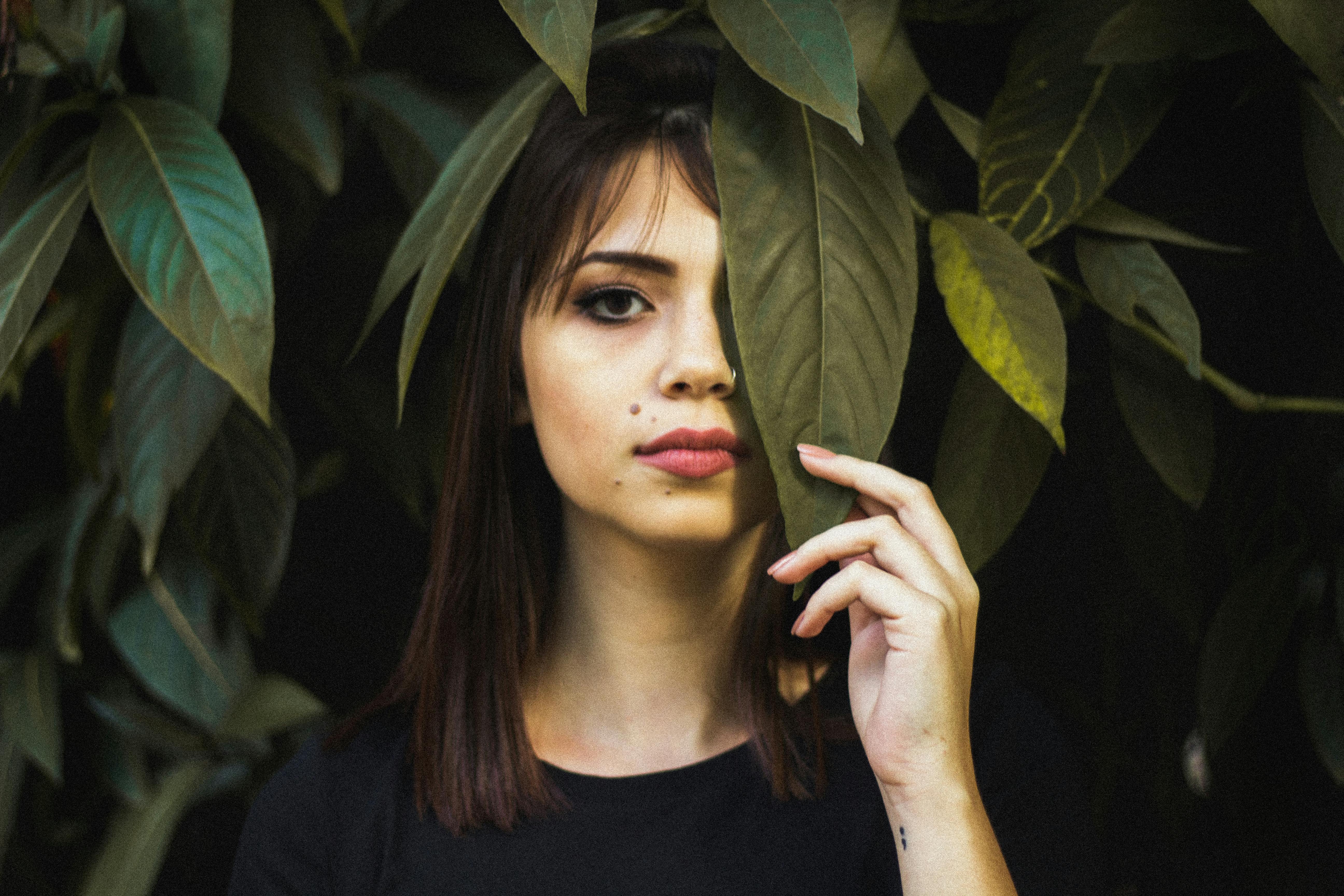 Photo of Woman Holding Leaf