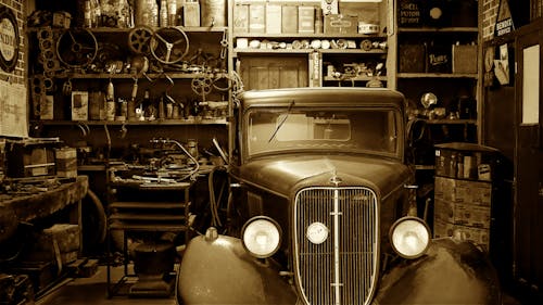 Black Vintage Car on Garage