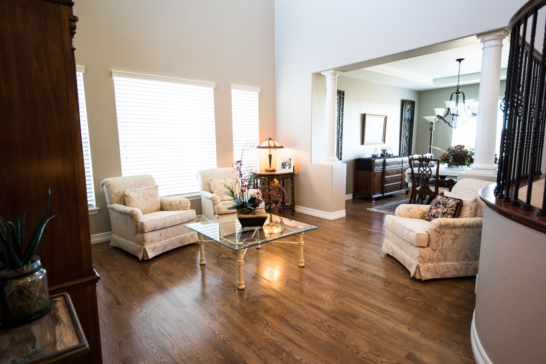 Spacious living room featuring classic furniture and elegant decor in a modern home setting.