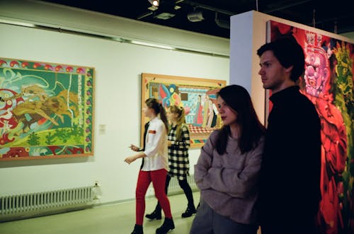 Woman Leaning on Man Standing Inside Room