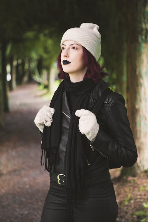 Woman Standing While Holding Scarf