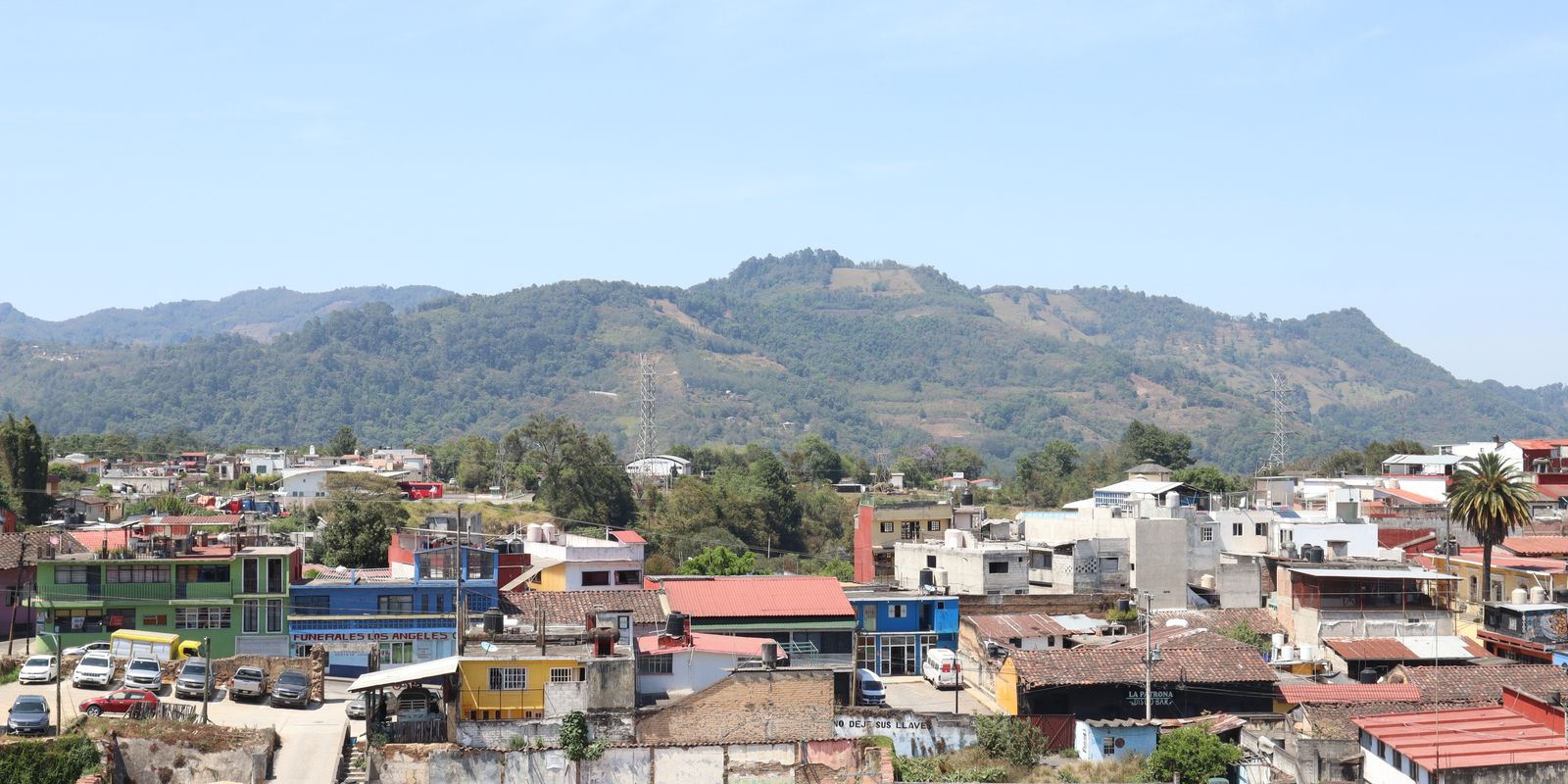 Colorful rooftops and hills in a small mountain town