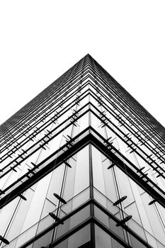 Striking low angle view of a modern glass office building in Chicago, IL.