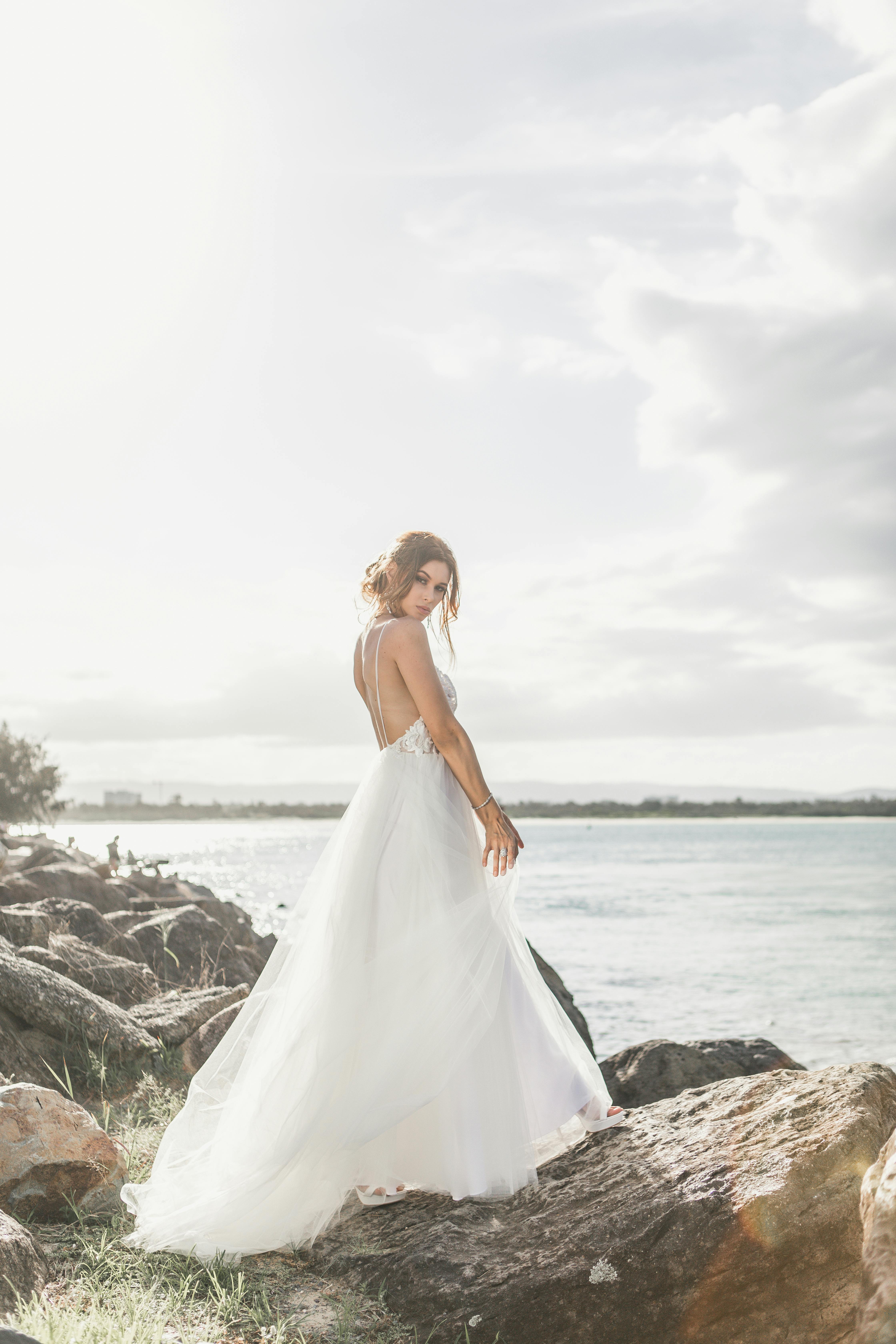 woman standing on rock