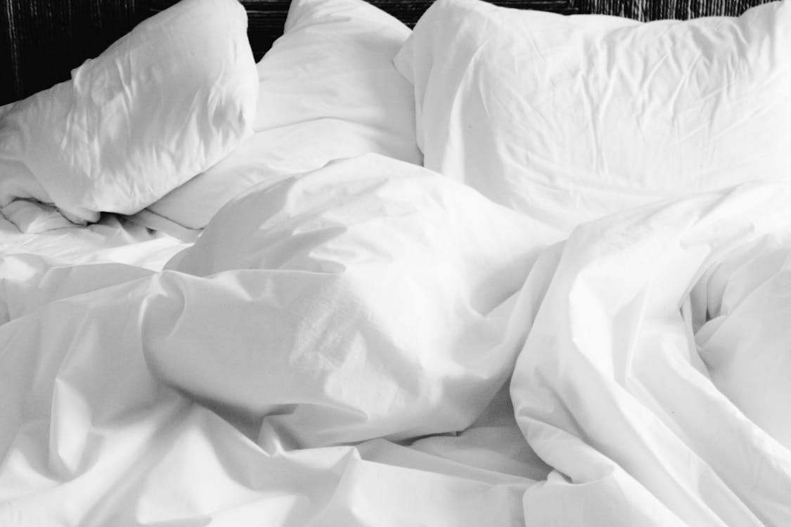 Free White Bed Comforter Stock Photo