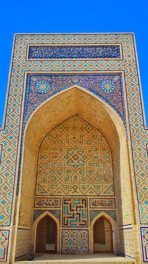 Free Majestic entrance of Kalan Mosque in Bukhara with intricate Islamic tilework. Stock Photo