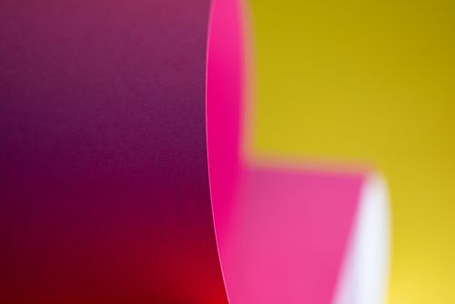 Free A vibrant abstract composition featuring colorful folded paper against a bright background. Stock Photo