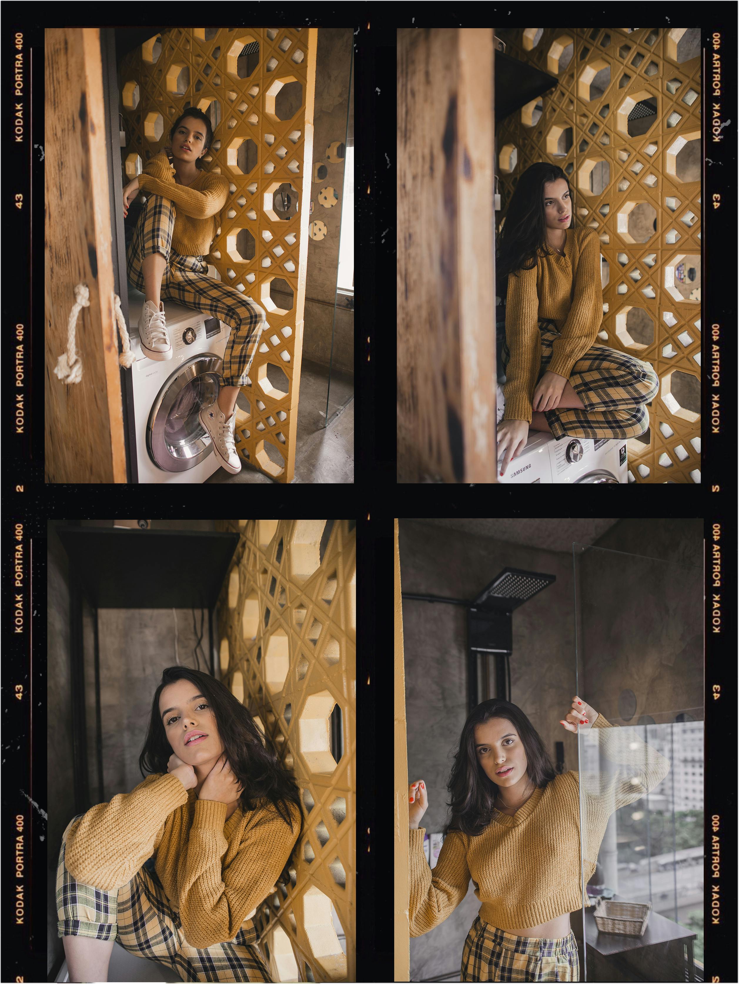 一位时尚的年轻女子在一间装饰独特的现代公寓里摆姿势