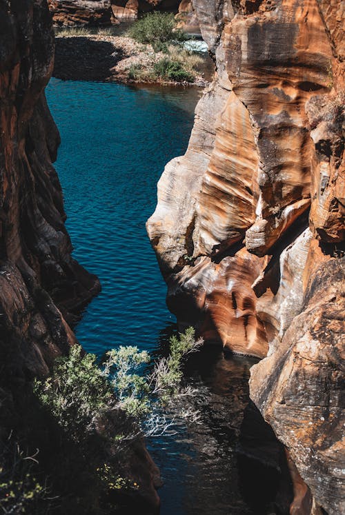 A view of a canyon with water flowing through it