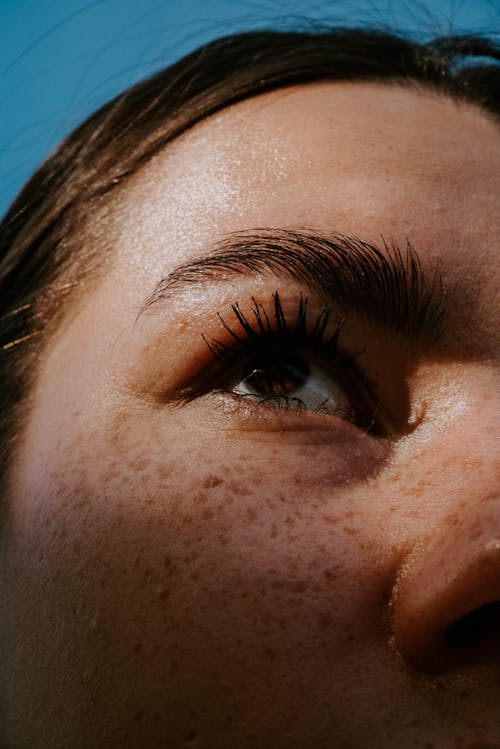 Close up of a woman's face with freckles