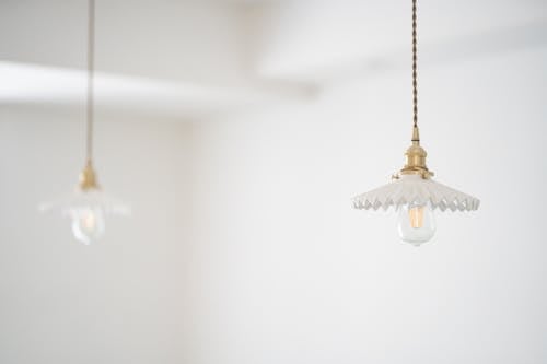 Free Two Copper-colored Pendant Lamps Stock Photo