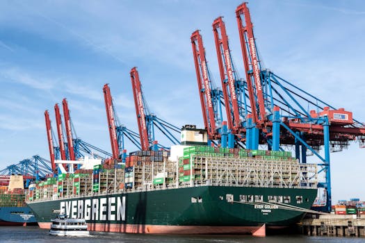 A large Evergreen cargo ship docked at the terminal in Hamburg, Germany.