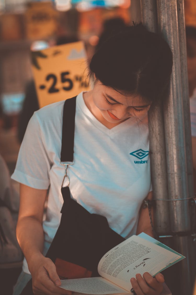 Photo Of Woman Reading A Book