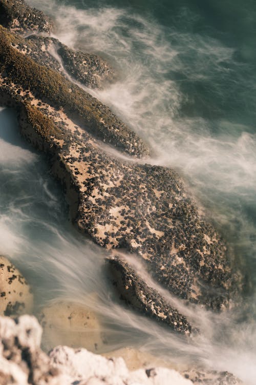 A close up of rocks and water in the ocean