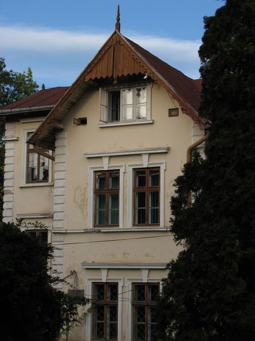 Free A vintage mansion's charming facade with unique architectural details, captured at dusk. Stock Photo