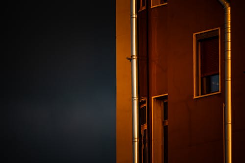 A building with a window and a pipe