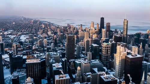 Free Stunning aerial view of Chicago's skyline with skyscrapers and the city covered in snow. Stock Photo