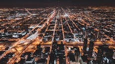 Aerial Photography Of City Buildings With Lights Turned On At Night