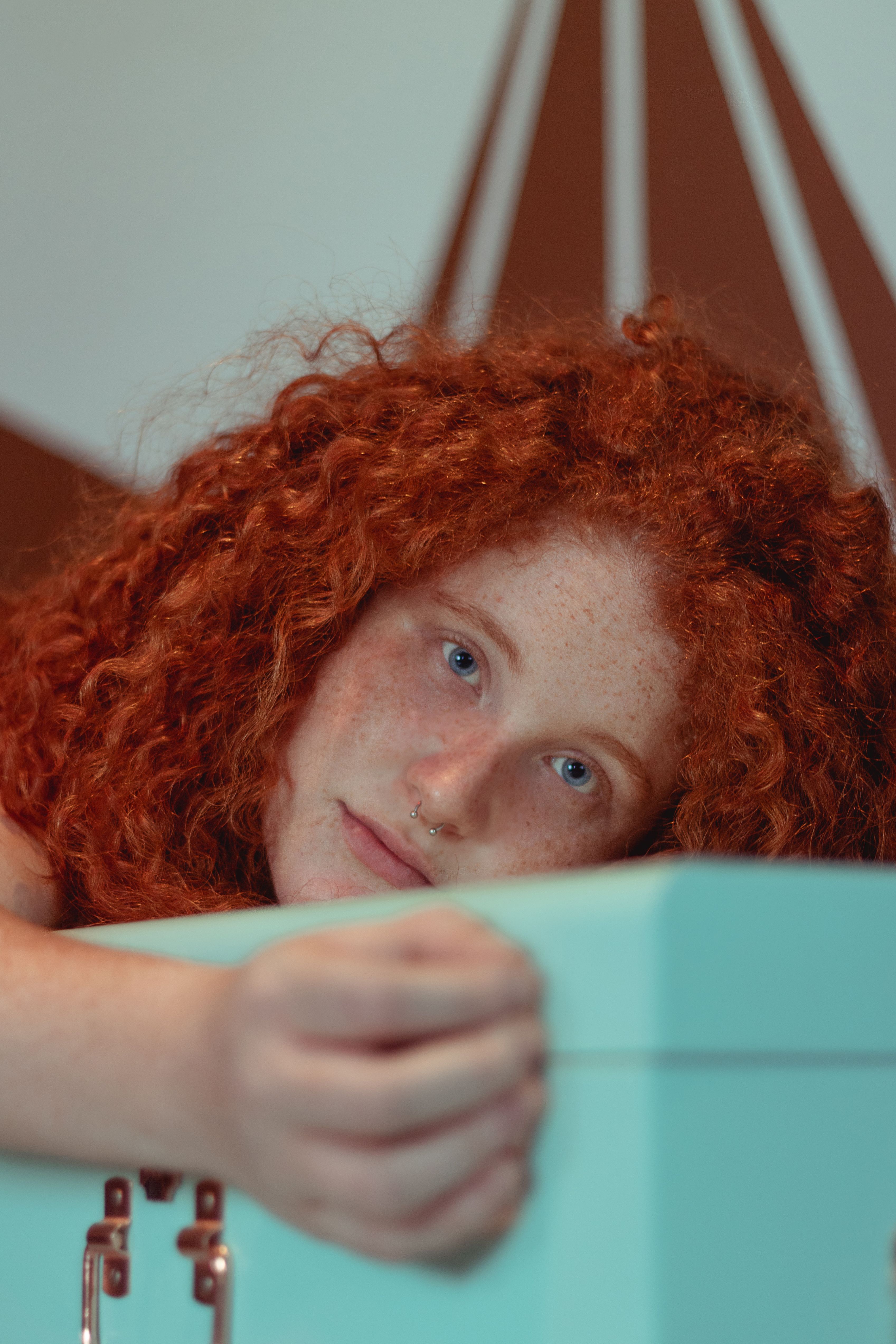 Portrait of a Woman with Curly Red Hair · Free Stock Photo