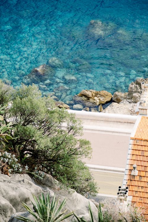 Free Aerial view of clear blue waters and a rooftop in the French Riviera, Nice. Stock Photo