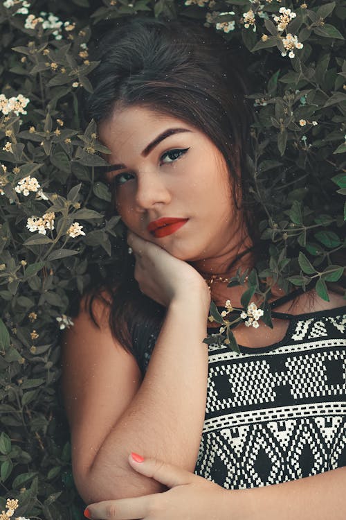 Free Woman Lying on Plants Stock Photo