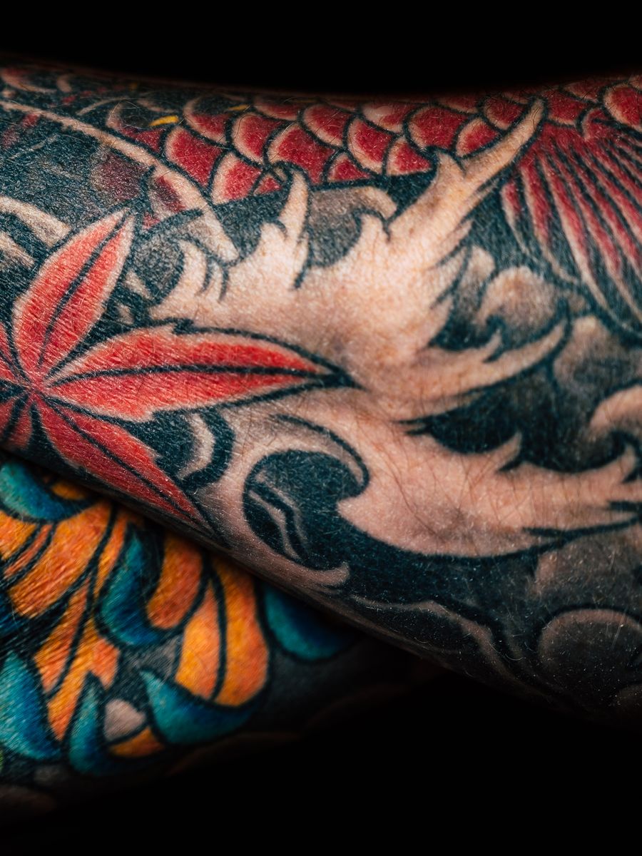 A large colour back piece in saturated greens and reds.