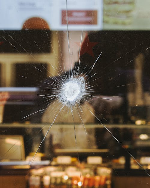 A bullet hole in a glass window