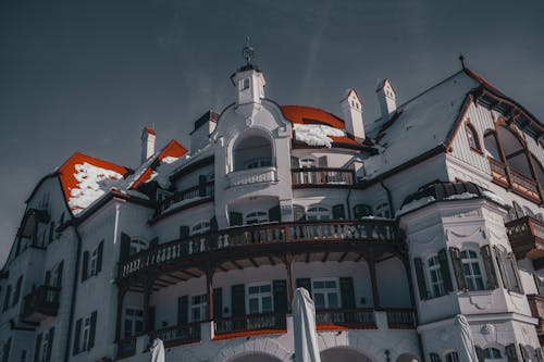 Low Angle Photography of White and Red Mansion