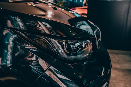 Shallow Focus Photography of Black Car Fender