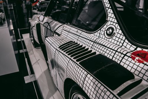 Free Stylish close-up of a classic car detail showcased in a Munich museum, highlighting modern automotive design. Stock Photo